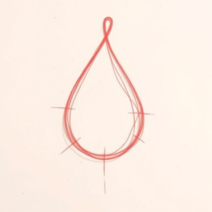 Loose Red Pencil Teardrop Tattoo